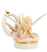 One pretty pixie, Tinker Bell puts her feet up in a compact with a pink powder puff. Delicate glaze and gold detail in Lenox fine china make it a Disney collectible all her fans will cherish. Qualifies for Rebate