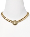 Carolee's antique coin link necklace is a bohemian way to accessorize. Slip on this style with a tiered gown to exude Grecian-inspired glamour.