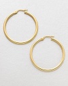 A simply classic, yet relevant design in radiant 18k gold. 18k goldLength, about 1.4Hinged post backMade in Italy
