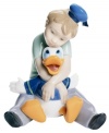 A childhood dream come true, this enchanting collectible depicts a young boy and Disney's Donald Duck in fine porcelain. From Nao by Lladro.