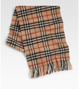 Iconic plaid design enhances this luxurious winter staple.Fringed edgesAbout 13W x 61LCashmereDry cleanImported