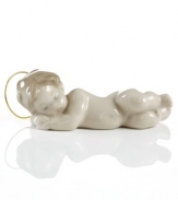 The artisans at Lladro have produced a small masterpiece in this sleeping baby Jesus figurine, complete with a metal halo. Handcrafted of porcelain in Spain.