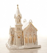 Just a sleigh ride away from the North Pole is a little village, untouched by time, called Mistletoe Park. This snowy chapel on the hill is one of its finest attractions. In softly sculpted ivory china with beautiful 24-karat gold accents.