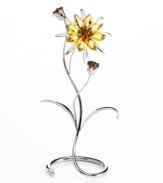 Marigold-inspired blossoms crafted in light topaz with smoked topaz crystal accents inspire instant cheer in any environment. The sunny yellow petals take root in a gracefully swirling, silvertone metal stand.