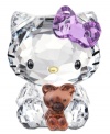 Cuter than ever, Hello Kitty cuddles her favorite teddy bear in this irresistible Swarovski crystal figurine. With printed whiskers and her trademark bow in sparkling violet.