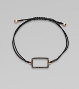 A knotted cord with a black diamond encrusted, 18K rose gold, rectangular link. Black diamonds, .28 tcw18K rose goldPolyester cordLink size, about ¾Length, about 13½ adjustableDrawstring closureImported 
