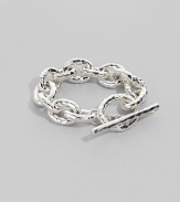 Bold links, subtly hammered, in shiny sterling silver with a chunky toggle closure. Sterling silver Length, about 8 Toggle closure Imported