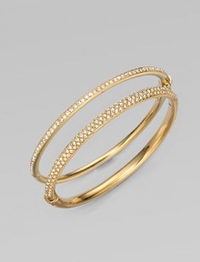 EXCLUSIVELY AT SAKS. Sparkling crystals shimmer within a glowing, golden hinged bangle. Crystal 18k goldplated Diameter, about 2¼ Push-lock clasp Imported Please note: Bracelets sold separately.