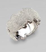 An arresting design that dazzles in plated rhodium. Brass Hinged, box and tongue closure Diameter, about 2¼ Width, about 1¼ Imported 