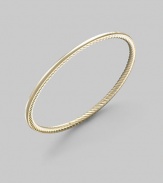 A unique bangle of 18k gold, polished on the outside with a twisted Yurman cable on the inside. 18k yellow gold Diameter, about 2½ Made in USA