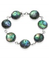 Inspire your look with ocean color. Genevieve & Grace's pretty link bracelet features round-cut abalone glass and glittering marcasite. Set in sterling silver. Approximate length: 7 inches.