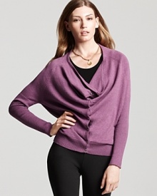 This Eileen Fisher organic cotton sweater puts a creative spin on the always-essential cardigan, fashioned with a plunging cowl neckline for an elegant drape. This Eileen Fisher organic cotton sweater puts a creative spin on the always-essential cardigan, fashioned with a plunging cowl neckline for an elegant drape.