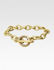 Bold, textured links in a gleaming gold finish have an ornate toggle closure. 18k goldplated Length, about 7½ Toggle closure with CRYSTALLIZED - Swarovski Elements accents Made in USA Bold, textured links in a gleaming gold finish have an ornate toggle closure. 18k goldplated Length, about 7½ Toggle closure with CRYSTALLIZED - Swarovski Elements accents Made in USA