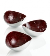 Full of surprises, these handcrafted nut bowls from the Simply Designz collection of serveware and serving dishes feature sleek, polished aluminum lined with lustrous burgundy enamel. A bold set for serving snacks or simply decorating the table.