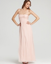 Master streamlined elegance in this Amsale strapless gown, flaunting a famously flattering empire waist. Master streamlined elegance in this Amsale strapless gown, flaunting a famously flattering empire waist.