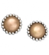 Simple studs with an extra edge. Set in sterling silver and 18k gold over sterling silver, these stud earrings by Jody Coyote offer a unique beaded design at the edges. Approximate diameter: 1/8 inch.