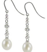 Sleek and sophisticated, this pair of sterling silver earrings dazzles with cultured freshwater pearls (9-9-1/2 mm) offset by rhodium-plated sparkle beads for a lustrous touch. Approximate drop: 1-7/8 inches.