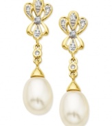 Go for the glamour. These drop earrings, crafted from 10k gold, dazzle with cultured freshwater pearls (7-9 mm) and diamond accents lending a shining touch. Approximate drop: 1-1/8 inch.
