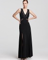 Sheer lace details lend allure to a sophisticated BCBGMAXAZRIA gown.