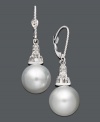 Illuminate your look with polish and shine. These elegant drop earrings highlight a cultured South Sea pearl (10-11 mm) and sparkling round-cut diamond (1/5 ct. t.w.). Crafted in 14k white gold. Approximate drop: 1-1/4 inches.