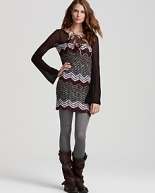 Hang with the hippie-chic crowd in a chevron-stripe Free People sweater dress. The mini silhouette partners with textured tights and slouchy boots for a boho look tinged with '70s appeal--on-trend and fabulous. Hang with the hippie-chic crowd in a chevron-stripe Free People sweater dress. The mini silhouette partners with textured tights and slouchy boots for a boho look tinged with '70s appeal--on-trend and fabulous.