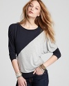 With a fashion-forward, color block design, Red Haute's not-so-basic tee looks fresh in a dolman-sleeved silhouette.