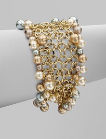 A chain link design embellished with multi-colored glass pearls. BrassGlass pearlsLength, about 7½Magnetic clasp closureImported 