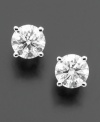A perfect carat of sparkle to add to your lobes. These scintillating studs include round-cut diamond (1 ct. t.w.) in a shining, polished 18k white gold setting. IGI Certified diamonds.