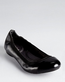 A lizard embossed cap toe lends an unexpected touch to Calvin Klein's Page flats, trimmed in elastic for flexible comfort. A lizard embossed cap toe lends an unexpected touch to Calvin Klein's Page flats, trimmed in elastic for flexible comfort.