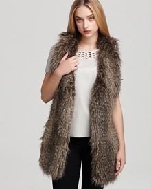 In plush faux fur, Black Halo's Braiden vest lends a cozy layer over a silk tee and black skinnies. In plush faux fur, Black Halo's Braiden vest lends a cozy layer over a silk tee and black skinnies.