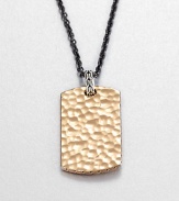 From the Palu Collection. The hand-hammered design motif of the Palu collection distinguishes a bronze dog tag pendant, connected by a sterling silver bale to a bold chain of blackened stainless steel.Bronze and sterling silverStainless steelChain length, about 24Pendant, about 2L X 1WLobster claspMade in Bali