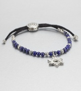 From the Batu Bedeg Collection. A beaded strand of carved silver and richly colored lapis is strung on a black fabric cord and highlighted by a stunning Star of David silver charm.LapisSterling silverAdjusts from about 6 to 9 longSliding bead closureMade in Bali