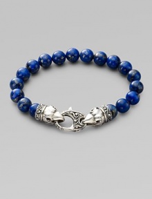 A welcome touch of color, strung with 10mm lapis beads and a raven's head sterling silver clasp. About 9¼ long Imported