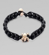 A modern array of black onyx beads are framed by leather detail and finished with a rose gold skull. OnyxLeatherRose goldLength, about 9Diameter, about 3 Clasp closureImported