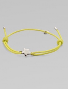 A knotted cord with a star link and a logo charm. Cotton cordArgento plated brassKnotted closureDiameter, about 2¼ adjustableImported A knotted cord with a star link and a logo charm. Cotton cordArgento plated brassKnotted closureDiameter, about 2¼ adjustableImported