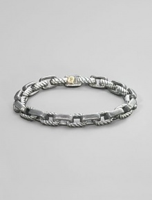 Textured empire link rendered in silver and 18k gold. Box clasp 8½ long Imported Textured empire link rendered in silver and 18k gold. Box clasp 8½ long Imported