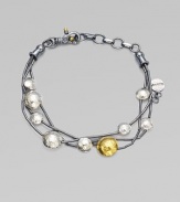 From the Lentil Collection. Strands of blackened sterling silver are stationed with hammered metal circles for an artsy finish.24K yellow gold Sterling silver Adjustable bracelet diameter, about 7-8 Lobster clasp Imported