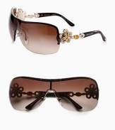 From the Mediterranean Flower Collection. These limited edition frames feature a gentle shield shape with brilliant, crystal accented flower temples. Available in silver/black with grey gradient lens or pale gold/dark brown with brown gradient lens. Crystal accented, flower logo temples100% UV protectionMade in Italy 