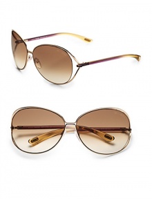 Round modified metal frames with open-end lens and tubular temples. Available in shiny rose gold with brown gradient lens.100% UV protection Made in Italy 