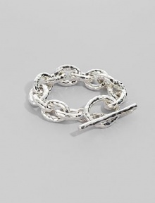 Bold links, subtly hammered, in shiny sterling silver with a chunky toggle closure. Sterling silver Length, about 8 Toggle closure Imported