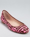 Neon pink pairs with rich, chocolate leather on these Rebecca Minkoff flats, woven in a geoemtric-meets-tribal pattern that works for every season.