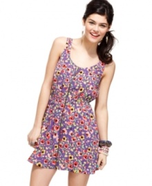 Dress to charm in this adorable frock from Material Girl, where crisscross back detail adds grade A spunk to a supremely girlish dress! Dress to charm in this adorable frock from Material Girl, where crisscross back detail adds grade A spunk to a supremely girlish dress!