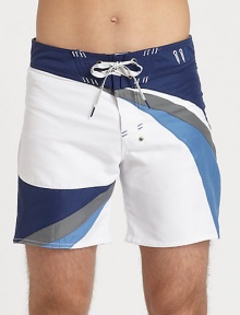 A charismatic, colorblocked design adorns this summer essential, in quick-drying nylon.Drawstring-tie waistInseam, about 7PolyesterMachine washImported A charismatic, colorblocked design adorns this summer essential, in quick-drying nylon.Drawstring-tie waistInseam, about 7PolyesterMachine washImported