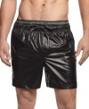 Shine on. Be a standout style star when you're playing in the sun and sand in these swim trunks from Calvin Klein.
