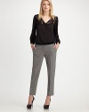 Striking contrast trim details the waistline and back pockets of this skinny pair for a modern look. Hook and bar closure Zip fly Side pockets Back welt pockets Contrast trim Inseam, about 30 95% wool/5% elastane Dry clean Imported 
