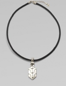 A carved sterling silver pendant drops from a finely braided leather necklace. From the Classic Chain Collection Sterling silver Leather Necklace, about 18 long Imported A carved sterling silver pendant drops from a finely braided leather necklace. From the Classic Chain Collection Sterling silver Leather Necklace, about 18 long Imported