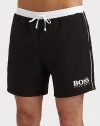 These handsome solid swim trunks sport a drawstring waistband and the classic BOSS logo.Elastic drawstring waistbandSide slash pocketsMesh liningInseam, about 6PolyamideMachine washImported