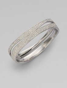 EXCLUSIVELY AT SAKS.COM. Curvaceous rows of pavé crystals decorate the wrist.Crystals Rhodium plated Width, about ¾ Diameter, about 2½ Push lock closure Imported