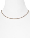 Officina Bernadia's rose gold and platinum necklace is a tasteful jewelry box update. Try wearing the understated style with sheer knits to showcase it's delicate shimmer.