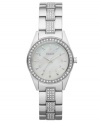 The classic styling of this DKNY timepiece has been given an upgrade of crystal shimmer. Crafted of stainless steel bracelet embellished with 90 crystal accents and round stainless steel case. Bezel embellished with 46 crystal accents. White dial features 12 crystal dot markers, silver tone three hands and logo at twelve o'clock. Quartz movement. Water resistant to 50 meters. Two-year limited warranty.